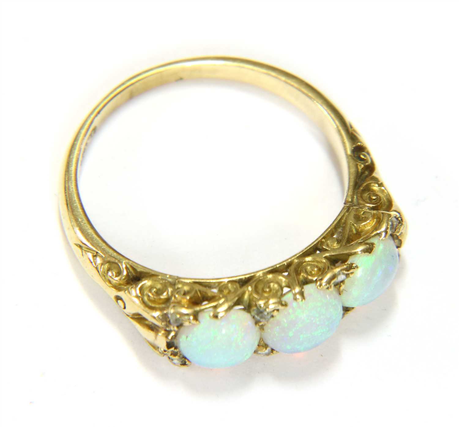 Lot 66 - A three stone opal ring