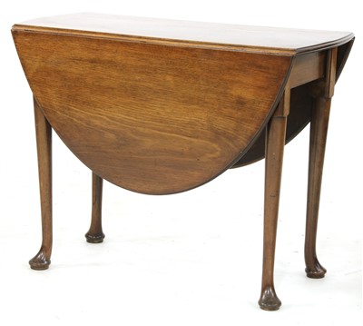 Lot 676 - A mahogany gateleg dining table