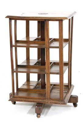 Lot 512 - An oak revolving bookcase