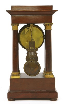 Lot 373 - A small French mahogany portico clock