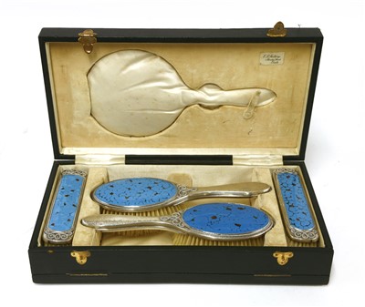 Lot 194 - An Arts and Crafts four-piece silver part-dressing table set