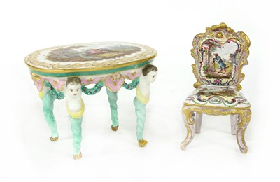 Lot 146 - A French pottery miniature chair and table