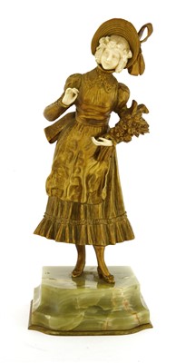 Lot 679 - A French gilt bronze and carved ivory figure