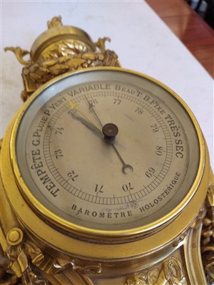Lot 166 - A French ormolu cartel clock and companion barometer