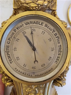 Lot 166 - A French ormolu cartel clock and companion barometer