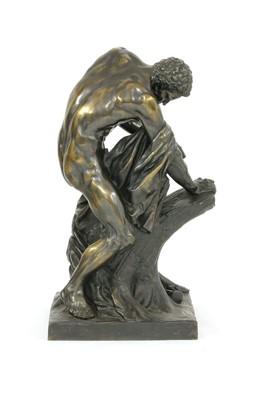 Lot 677 - A large bronze figure of an athlete splitting a tree trunk