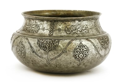Lot 539 - A Persian turned copper metal basin