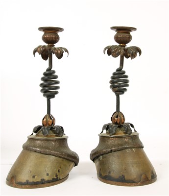 Lot 227 - A pair of wrought iron and horse hoof candlesticks