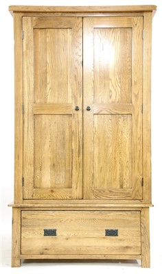 Lot 718 - A modern oak double wardrobe