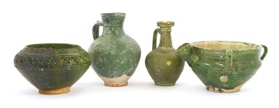 Lot 476 - Four Persian green-glazed pottery vessels