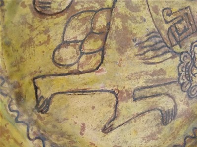 Lot 475 - A Fustat Fatimid yellow-glazed sgraffito dish
