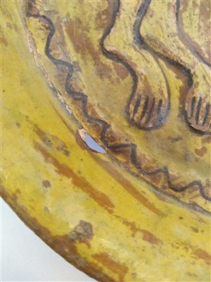 Lot 475 - A Fustat Fatimid yellow-glazed sgraffito dish