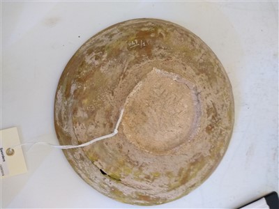 Lot 475 - A Fustat Fatimid yellow-glazed sgraffito dish