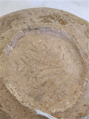 Lot 475 - A Fustat Fatimid yellow-glazed sgraffito dish