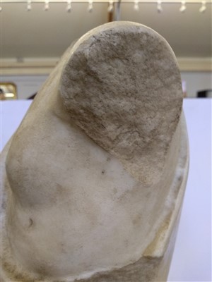 Lot 365 - A Roman white marble torso of a child