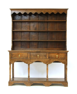 Lot 580 - An 18th century oak dresser