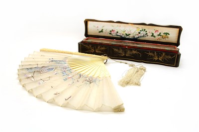 Lot 184 - A late 19th century carved ivory and silk fan