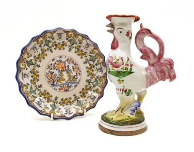 Lot 394 - A St Clement faience candlestick in the form of a cockerel