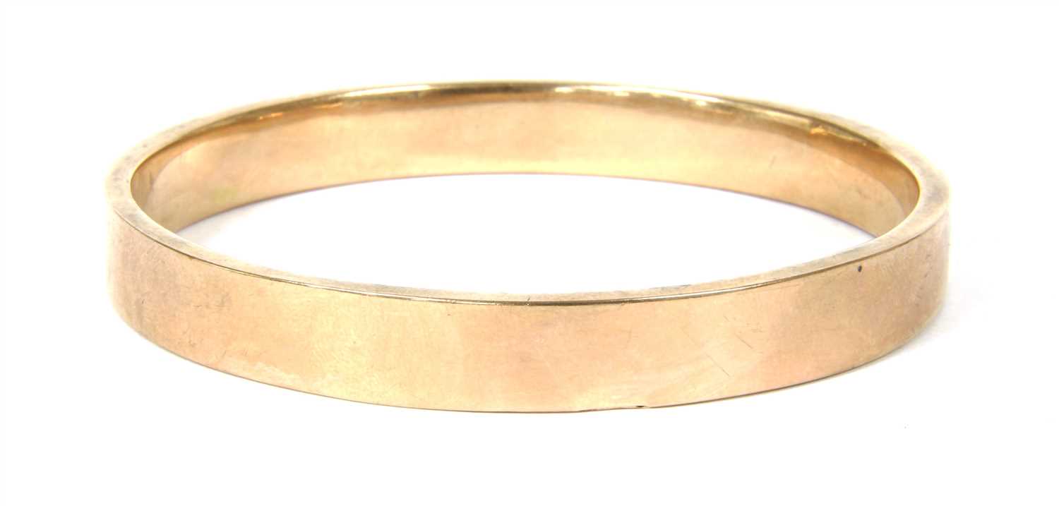 Lot 51 - A 9ct gold hollow flat section bangle