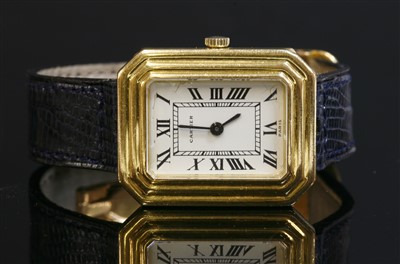 Lot 635 - A ladies' 18ct gold Cartier mechanical strap watch