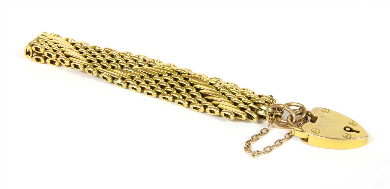 Lot 6 - An Edwardian gold gate style bracelet