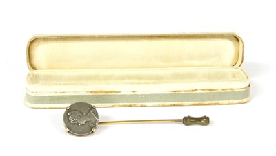 Lot 1 - A Continental gold stick pin with an Art Nouveau medallion claw set in the top
