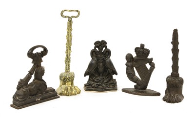 Lot 281 - A Victoria brass doorstop in the form of a lion's paw