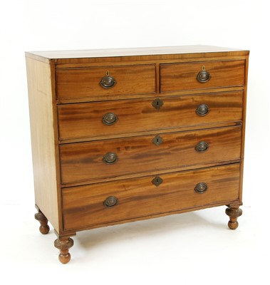 Lot 518 - A George III mahogany straight front chest of two short and three long drawers