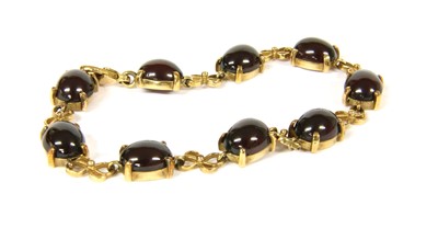 Lot 29 - A 9ct gold cabochon garnet bracelet