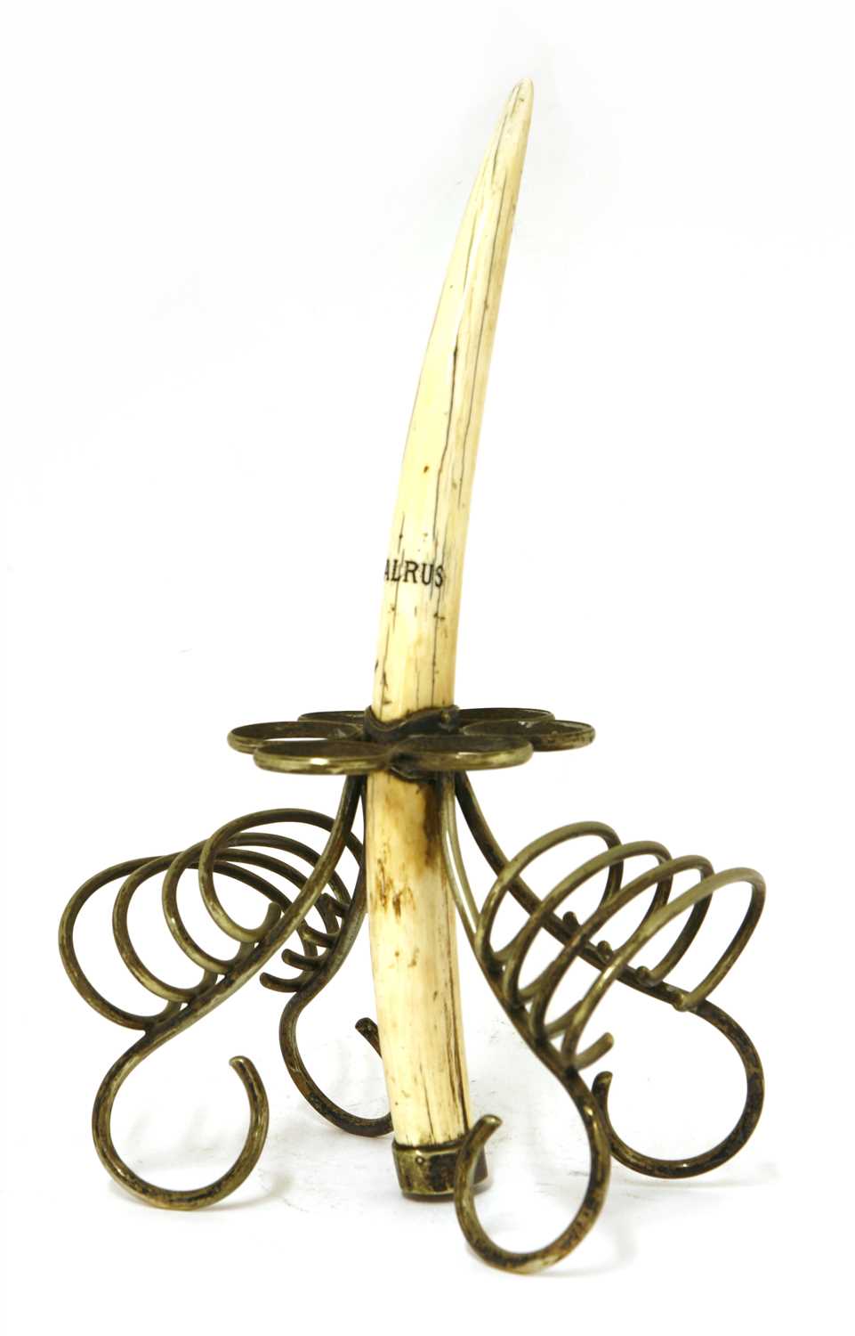Lot 202 - A walrus tusk and silver-plated mounted egg and toast rack