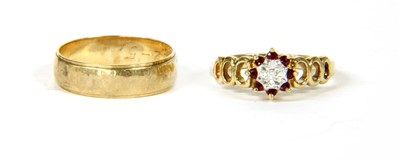 Lot 42 - A 9ct gold diamond and ruby illusion set cluster ring