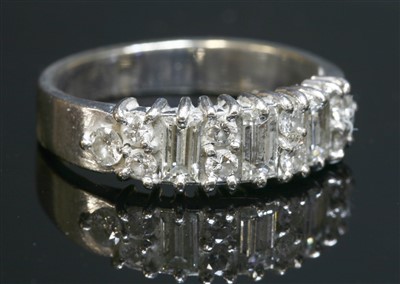 Lot 514 - A white gold diamond half eternity ring