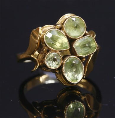 Lot 396 - An 18ct gold five stone peridot ring