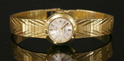 Lot 606 - An 18ct gold ladies' Omega Ladymatic automatic bracelet watch