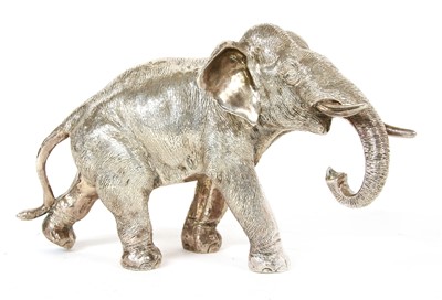 Lot 144 - A silver clad elephant
