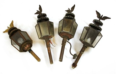 Lot 423 - A set of four coaching lamps