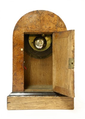 Lot 24 - A French amboyna mantel clock
