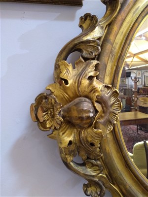 Lot 358 - A large oval giltwood wall mirror