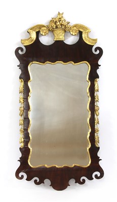 Lot 380 - A George II walnut and gilt-highlighted wall mirror