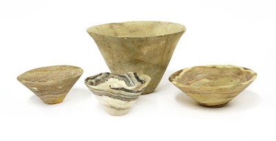 Lot 521 - Four early banded alabaster bowls