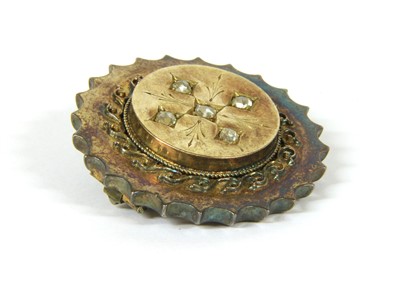 Lot 5 - A Victorian gold circular shield brooch form brooch