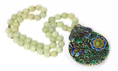 Lot 324 - A Chinese jade and cloisonné pendant