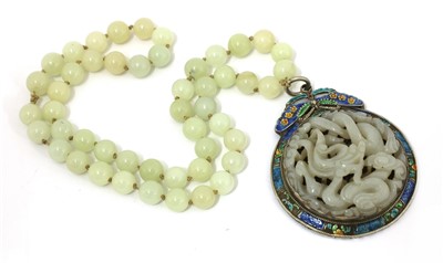 Lot 324 - A Chinese jade and cloisonné pendant