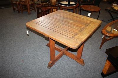 Lot 111 - An Heal's teak garden table and four chairs