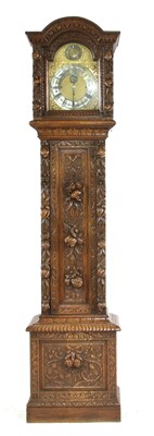 Lot 393 - A tall 19th century carved oak longcase clock