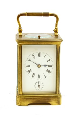 Lot 125 - A brass cased carriage clock with repeater movement