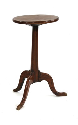Lot 627 - A primitive yew candle stand