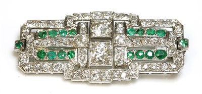 Lot 203 - An Art Deco emerald and diamond plaque brooch, c.1925