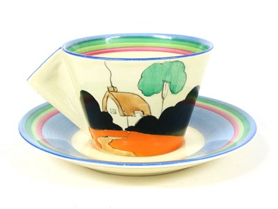 Lot 157 - A Clarice Cliff 'Crinoline Lady' pattern tea cup and saucer
