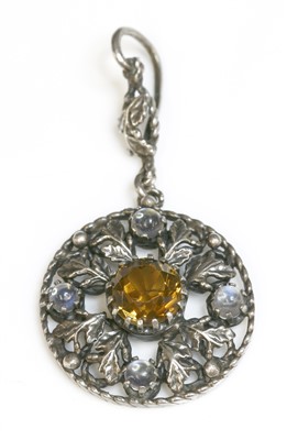 Lot 101 - A silver Arts and Crafts smoky quartz and moonstone pendant, c.1910